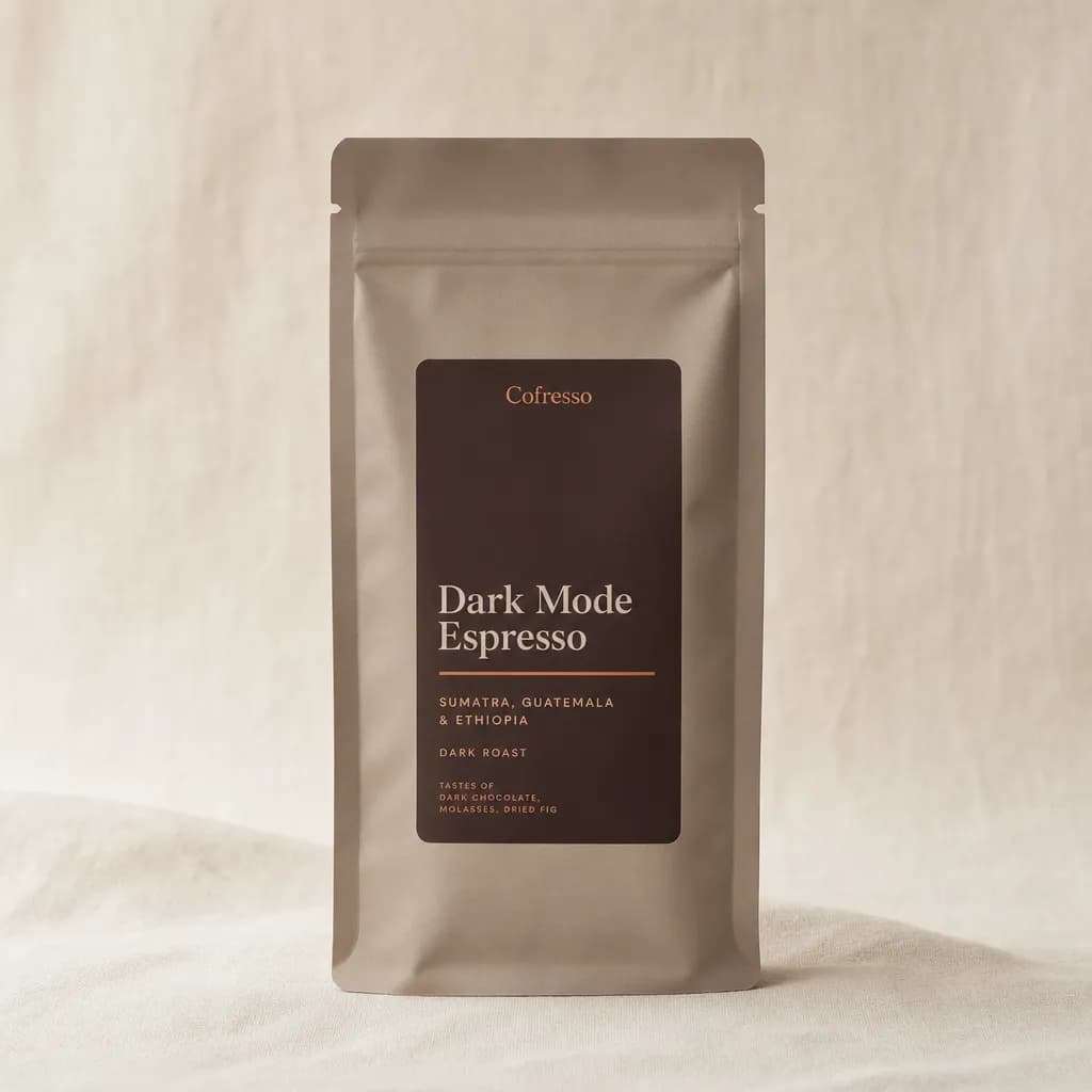 A bag of Cofresso Dark Mode Espresso coffee from Sumatra, Guatemala & Ethiopia on a cream linen backdrop